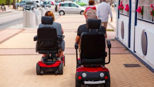 Mechanized wheelchair on street — Disability Support in Wollongong, NSW