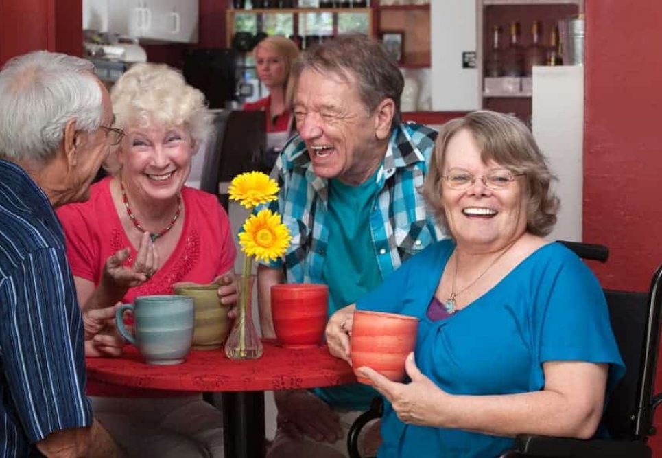 Old man and old lady laughing together — Disability Support in Wollongong, NSW
