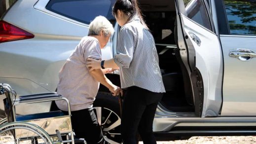 Caregiver Helping Disabled Elderly Woman — Disability Support in Wollongong, NSW
