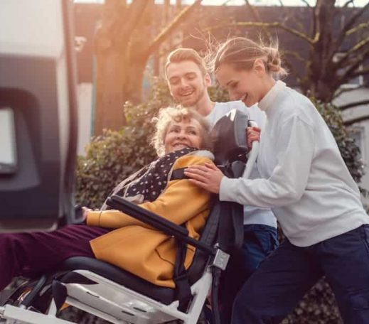 Old lady on a wheelchair being lifted — Disability Support in Wollongong, NSW