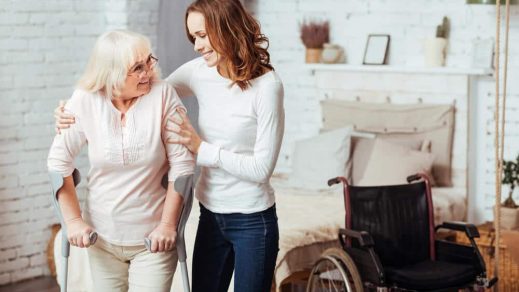 Woman Helping Disabled Grandmother — Disability Support in Wollongong, NSW