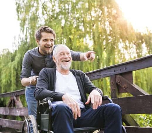 Happy old man on wheelchair — Disability Support in Wollongong, NSW